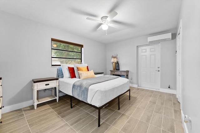 4501 N Australian Ave, West Palm Beach, FL 33407 - bedroom featuring an AC wall unit, baseboards, and a ceiling fan