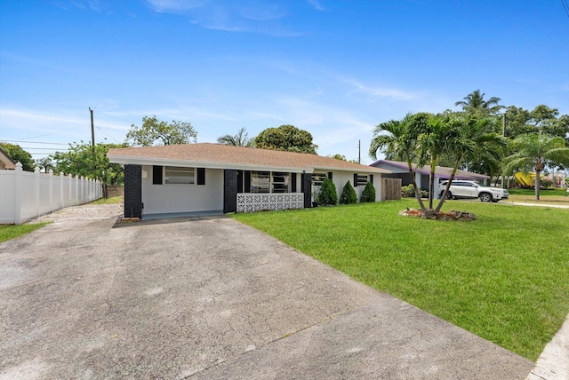 4501 N Australian Ave, West Palm Beach, FL 33407 - ranch-style home with driveway and brick siding