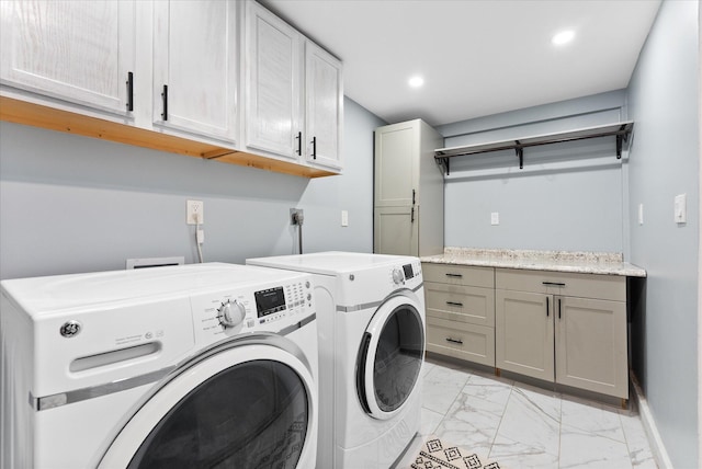 4501 N Australian Ave, West Palm Beach, FL 33407 - laundry room featuring cabinet space, light marble finish flooring, washing machine and dryer, recessed lighting, and baseboards