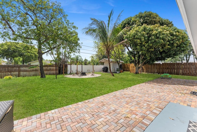 4501 N Australian Ave, West Palm Beach, FL 33407 - view of yard with a patio area and an outdoor fire pit