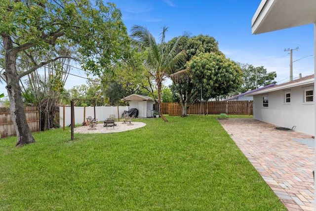 4501 N Australian Ave, West Palm Beach, FL 33407 - view of yard with a patio and an outdoor fire pit
