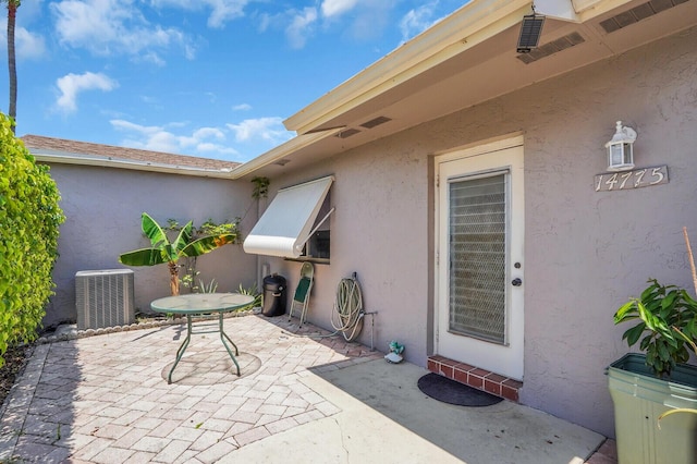 14775 Wildflower Ln, Delray Beach, FL 33446 - view of patio / terrace with central AC unit