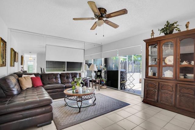 14775 Wildflower Ln, Delray Beach, FL 33446 - living room featuring ceiling fan, light tile patterned floors, and a textured ceiling