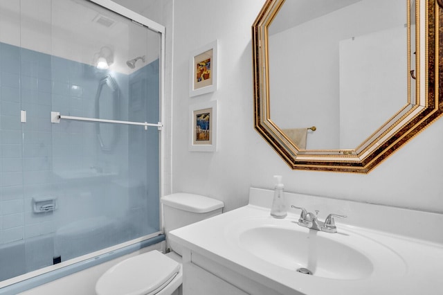 14775 Wildflower Ln, Delray Beach, FL 33446 - bathroom featuring toilet, vanity, and enclosed tub / shower combo