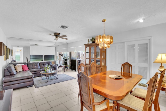 14775 Wildflower Ln, Delray Beach, FL 33446 - dining space with a textured ceiling, a chandelier, a ceiling fan, and light tile patterned floors