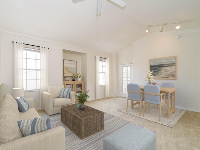 2536 57th Cir, Vero Beach, FL 32966 - carpeted living room featuring track lighting, vaulted ceiling, crown molding, ceiling fan, and baseboards