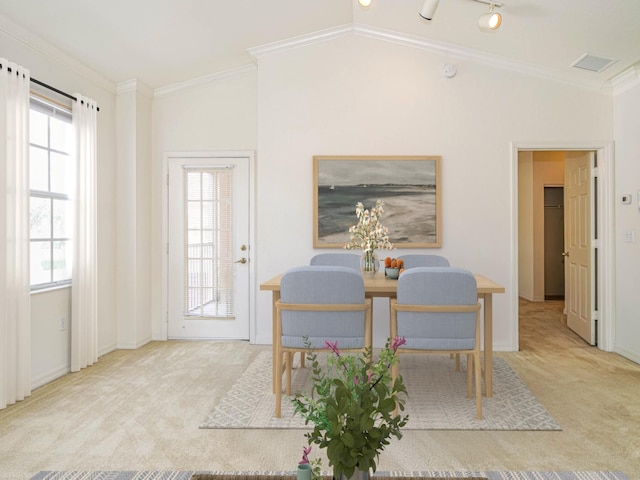 2536 57th Cir, Vero Beach, FL 32966 - dining space with carpet flooring, lofted ceiling, crown molding, and baseboards