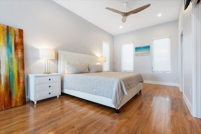 10851 S Ocean Dr Unit 84, Jensen Beach, FL 34957 - bedroom featuring light wood-style floors, baseboards, ceiling fan, and multiple windows