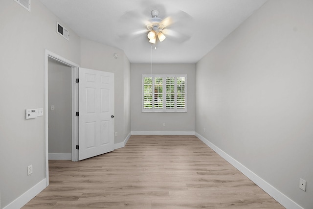 1595 SE Pomeroy St, Stuart, FL 34997 - empty room featuring a ceiling fan, light wood-type flooring, and baseboards