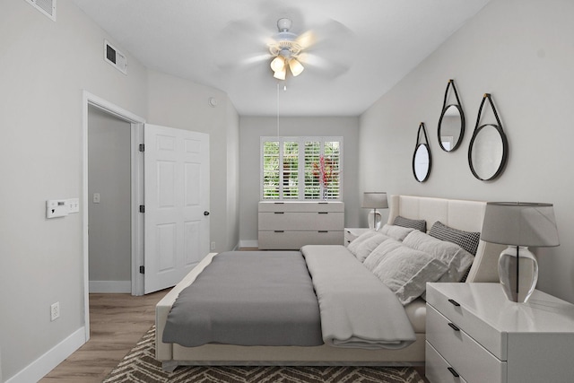 1595 SE Pomeroy St, Stuart, FL 34997 - bedroom with light wood-style flooring, baseboards, and a ceiling fan
