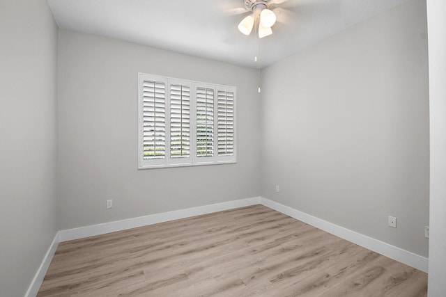 1595 SE Pomeroy St, Stuart, FL 34997 - unfurnished room with a ceiling fan, wood finished floors, and baseboards