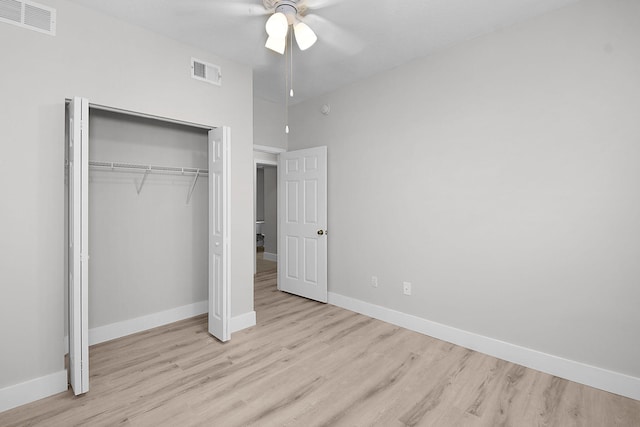 1595 SE Pomeroy St, Stuart, FL 34997 - unfurnished bedroom featuring wood finished floors, baseboards, a closet, and a ceiling fan