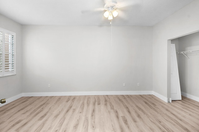 1595 SE Pomeroy St, Stuart, FL 34997 - unfurnished bedroom featuring light wood finished floors, baseboards, a closet, and ceiling fan