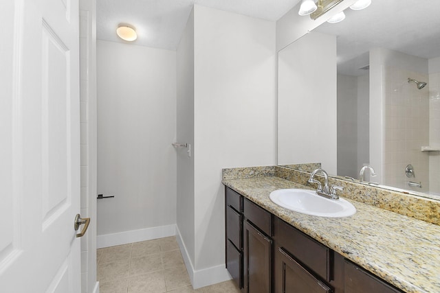 1595 SE Pomeroy St, Stuart, FL 34997 - bathroom with vanity, tile patterned floors, and baseboards