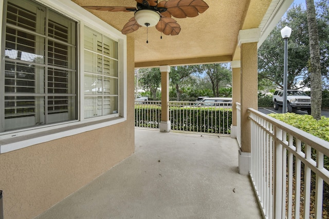 1595 SE Pomeroy St, Stuart, FL 34997 - covered porch with a ceiling fan