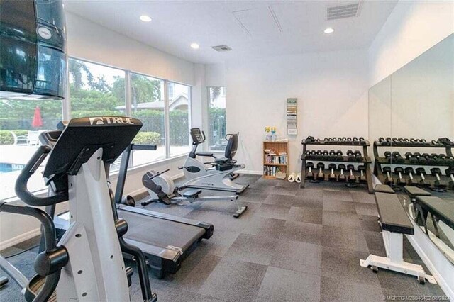 1595 SE Pomeroy St, Stuart, FL 34997 - workout area featuring recessed lighting and baseboards