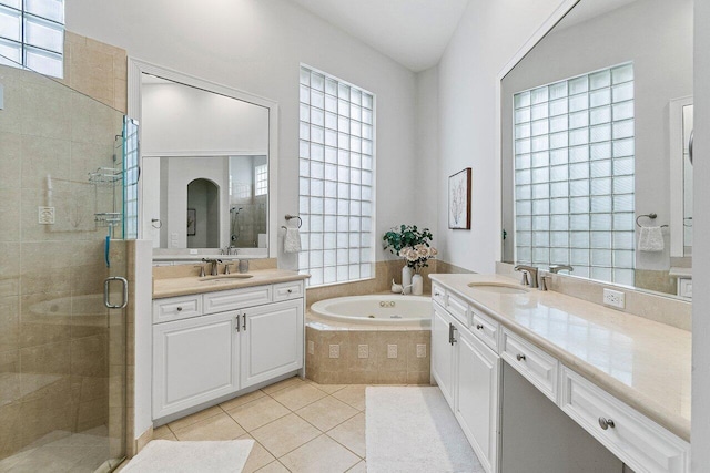 102 Andalusia Way, Palm Beach Gardens, FL 33418 - full bathroom featuring a stall shower, two vanities, a jetted tub, and tile patterned floors