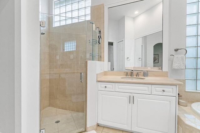 102 Andalusia Way, Palm Beach Gardens, FL 33418 - bathroom with a bath, a shower stall, vanity, and tile patterned floors