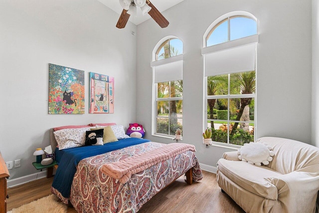 102 Andalusia Way, Palm Beach Gardens, FL 33418 - bedroom featuring baseboards, wood finished floors, a high ceiling, and ceiling fan