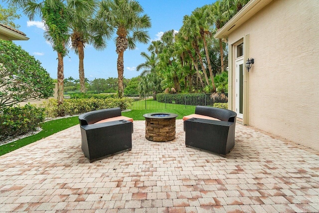 102 Andalusia Way, Palm Beach Gardens, FL 33418 - view of patio / terrace featuring an outdoor fire pit