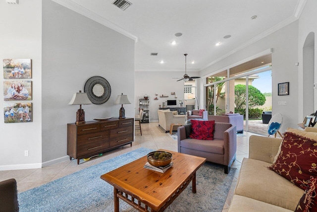 102 Andalusia Way, Palm Beach Gardens, FL 33418 - living area with ornamental molding, light tile patterned flooring, a ceiling fan, arched walkways, and baseboards