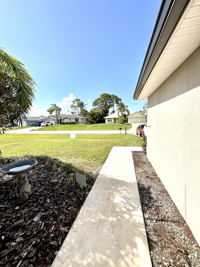 1206 SW Bargello Ave SW, Port Saint Lucie, FL 34953 - view of green lawn