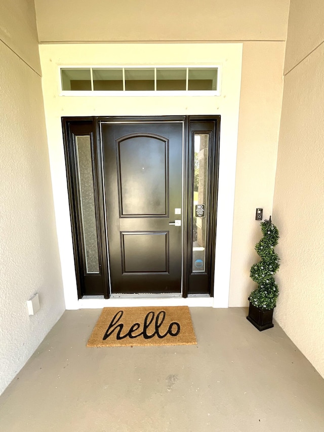 1206 SW Bargello Ave SW, Port Saint Lucie, FL 34953 - doorway to property with stucco siding