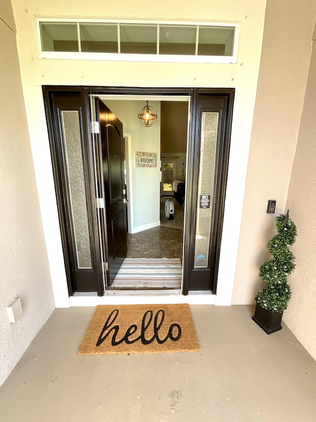 1206 SW Bargello Ave SW, Port Saint Lucie, FL 34953 - property entrance with stucco siding
