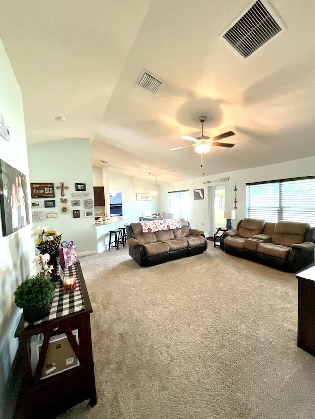 1206 SW Bargello Ave SW, Port Saint Lucie, FL 34953 - living room with a ceiling fan, carpet flooring, baseboards, and vaulted ceiling