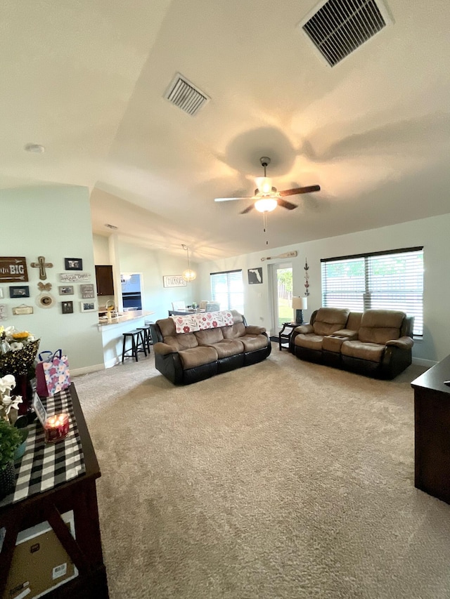 1206 SW Bargello Ave SW, Port Saint Lucie, FL 34953 - carpeted living area with ceiling fan, baseboards, and lofted ceiling