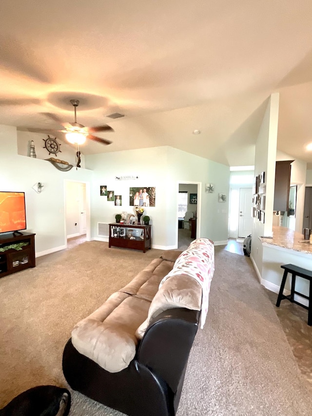 1206 SW Bargello Ave SW, Port Saint Lucie, FL 34953 - carpeted living area featuring baseboards, a ceiling fan, and lofted ceiling