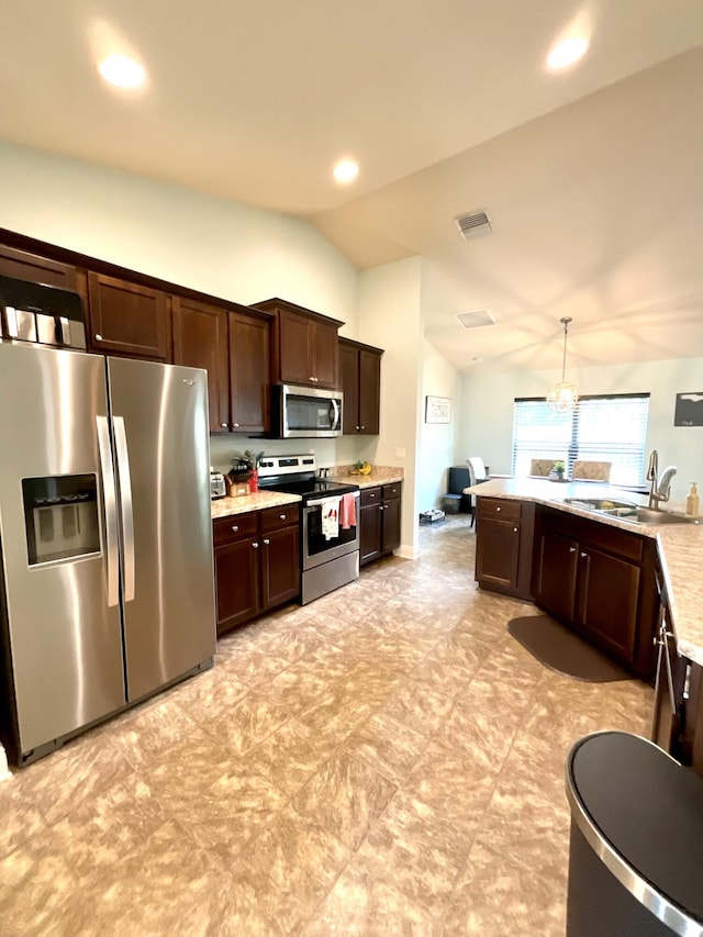 1206 SW Bargello Ave SW, Port Saint Lucie, FL 34953 - kitchen featuring stainless steel appliances, vaulted ceiling, a sink, dark brown cabinets, and light countertops