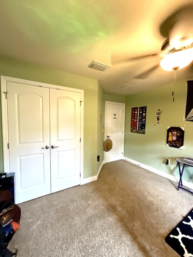 1206 SW Bargello Ave SW, Port Saint Lucie, FL 34953 - unfurnished bedroom with baseboards, carpet flooring, a closet, and ceiling fan