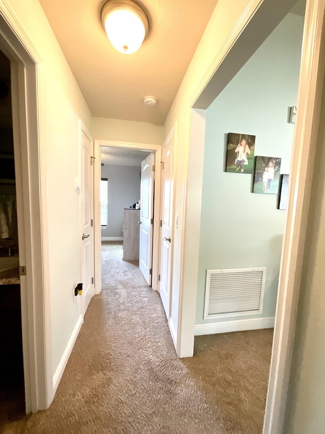 1206 SW Bargello Ave SW, Port Saint Lucie, FL 34953 - hallway featuring carpet and baseboards