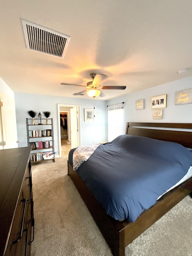 1206 SW Bargello Ave SW, Port Saint Lucie, FL 34953 - bedroom featuring carpet flooring, a spacious closet, and a ceiling fan