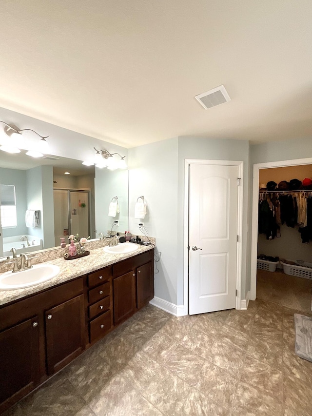 1206 SW Bargello Ave SW, Port Saint Lucie, FL 34953 - full bath featuring a shower stall, double vanity, a garden tub, and a walk in closet