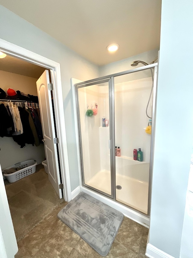 1206 SW Bargello Ave SW, Port Saint Lucie, FL 34953 - full bathroom with a stall shower and a walk in closet
