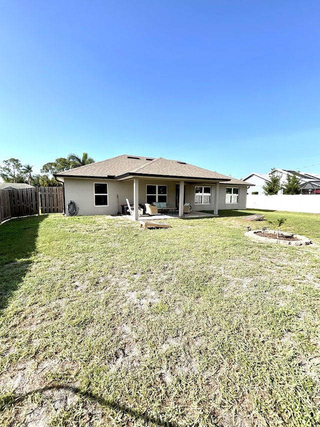 1206 SW Bargello Ave SW, Port Saint Lucie, FL 34953 - back of property with a patio and stucco siding