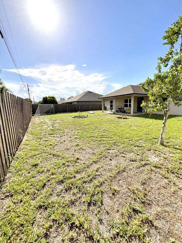 1206 SW Bargello Ave SW, Port Saint Lucie, FL 34953 - view of yard with a patio area