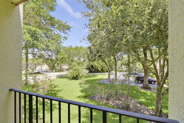 1700 Presidential Way Unit 201, West Palm Beach, FL 33401 - view of yard featuring a balcony