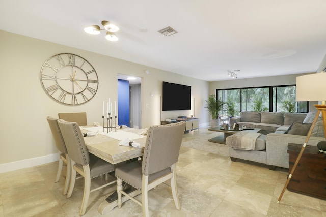 1700 Presidential Way Unit 201, West Palm Beach, FL 33401 - dining room featuring baseboards