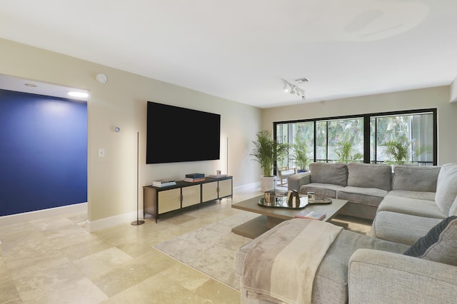1700 Presidential Way Unit 201, West Palm Beach, FL 33401 - living room with rail lighting and baseboards