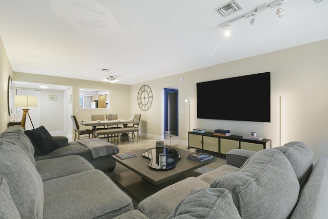 1700 Presidential Way Unit 201, West Palm Beach, FL 33401 - living area with baseboards and track lighting
