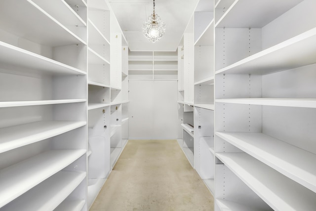 1700 Presidential Way Unit 201, West Palm Beach, FL 33401 - walk in closet featuring a chandelier