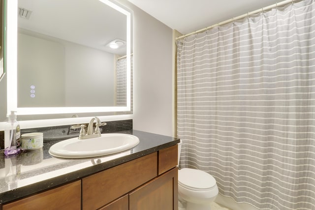 1700 Presidential Way Unit 201, West Palm Beach, FL 33401 - full bathroom featuring vanity, toilet, and a shower with shower curtain