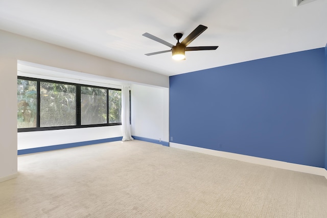 1700 Presidential Way Unit 201, West Palm Beach, FL 33401 - carpeted spare room with ceiling fan and baseboards
