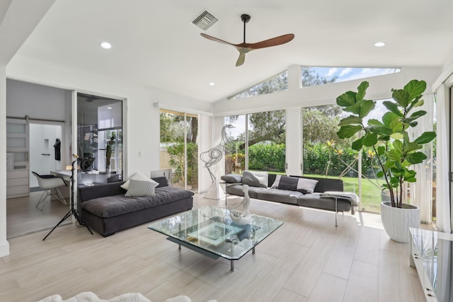 13853 Palm Grove Pl, West Palm Beach, FL 33418 - living room featuring a barn door, a ceiling fan, lofted ceiling, recessed lighting, and light wood-style flooring