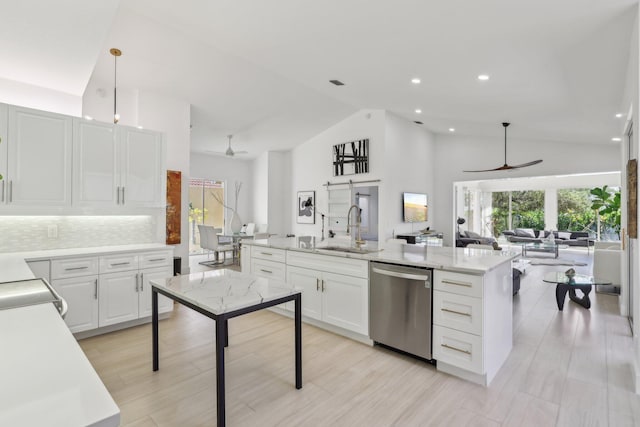 13853 Palm Grove Pl, West Palm Beach, FL 33418 - kitchen featuring stainless steel dishwasher, ceiling fan, a sink, open floor plan, and healthy amount of natural light