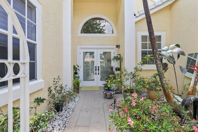 13853 Palm Grove Pl, West Palm Beach, FL 33418 - entrance to property featuring french doors and stucco siding