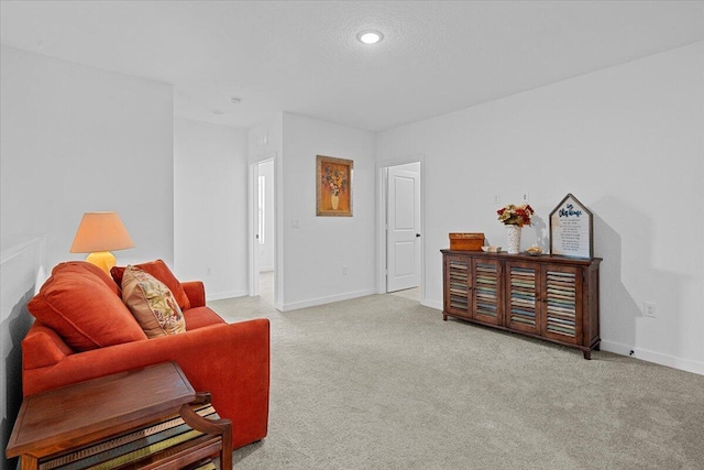 821 NE Trailside Run, Port Saint Lucie, FL 34983 - sitting room with baseboards, light carpet, and recessed lighting